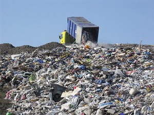 Dumping trash in a landfill